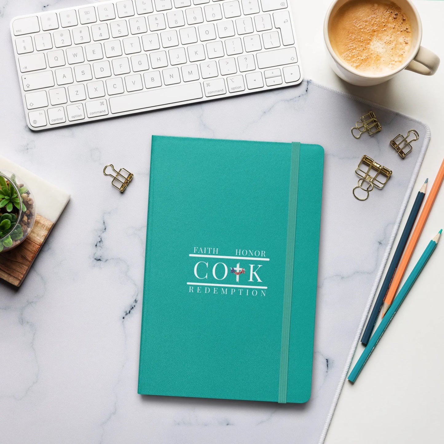 COTK Christian faith hardcover bound notebook in turquoise with American flag draped over the cross, with the words faith, honor, redemption.