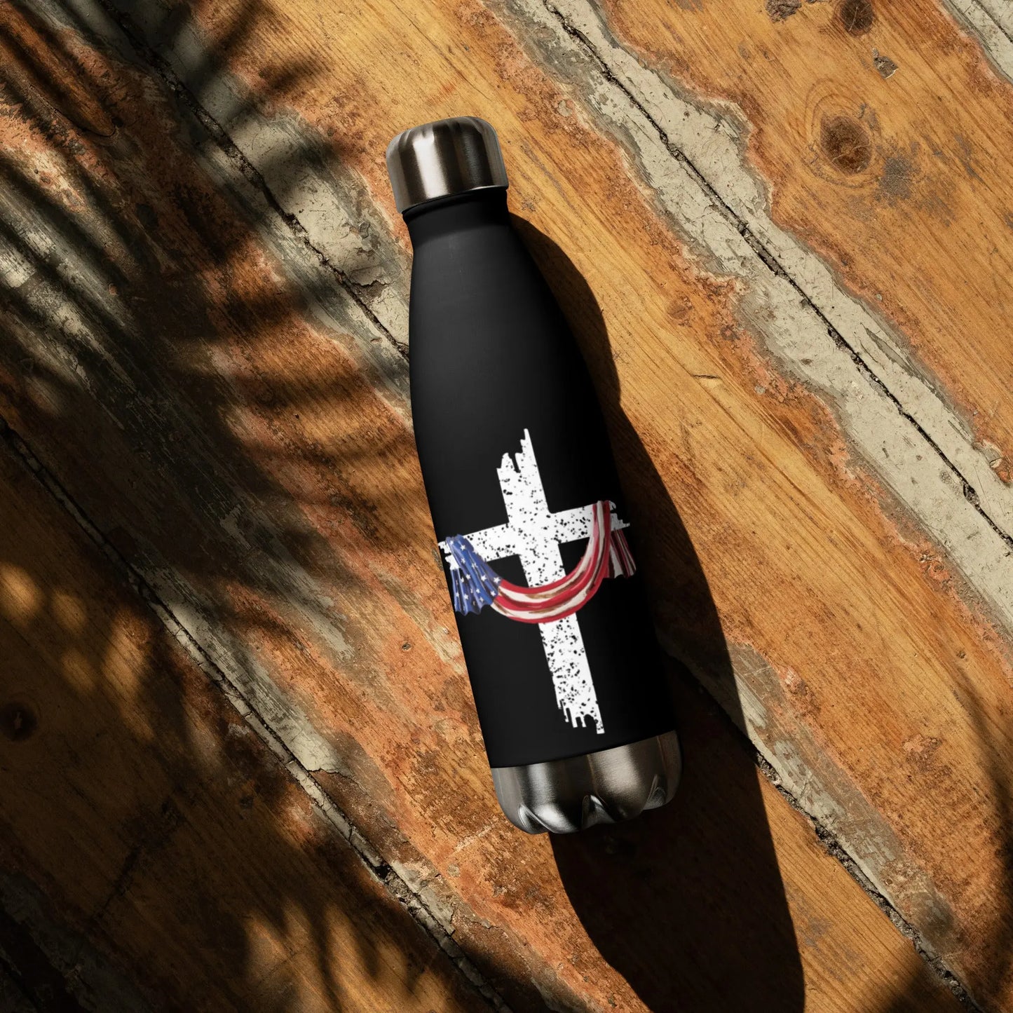 COTK Christian faith stainless steel water bottle 17 oz in black with American flag draped over the cross
